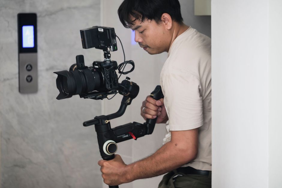 Wedding videographer holding camera on location